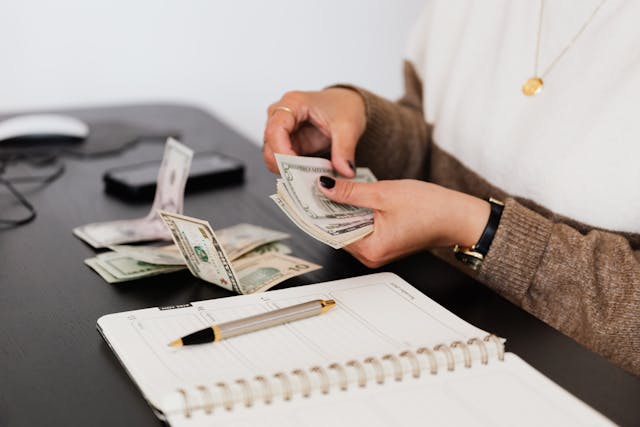 person counting cash